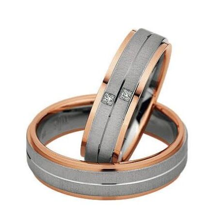 Zweifarbige Ringe aus Roségold und Silber von Eternity auf weißem Hintergrund