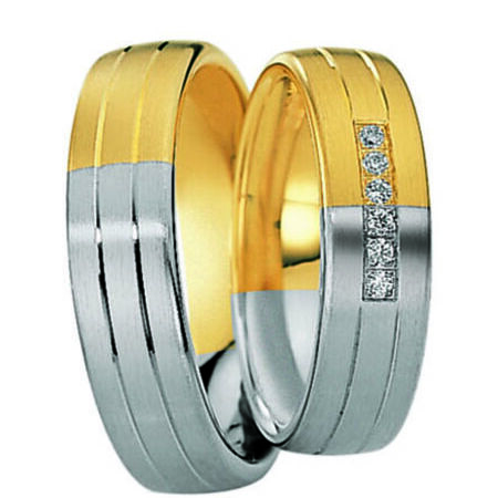 Zweifarbige Ringe aus Gold und Silber von Eternity auf weißem Hintergrund